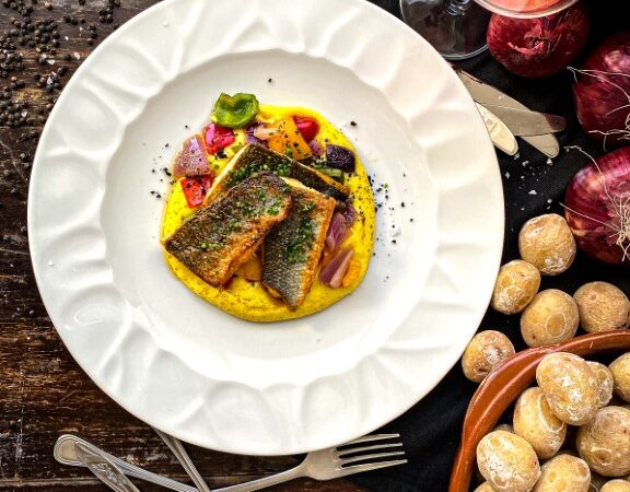 Local seabass filet, cooked to perfection over a smooth saffron potato pureé.