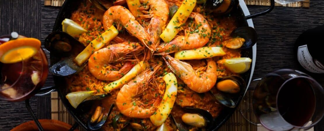 Classic spanish seafood paella with fish, mussels, prawns and squid.